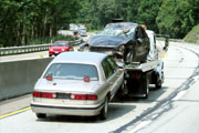 Towing truck taking car