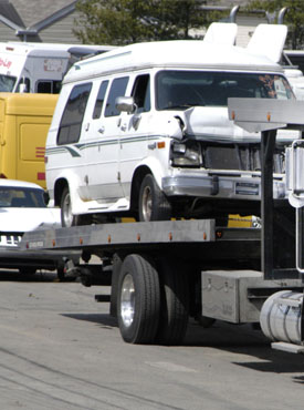 Towing truck taking car