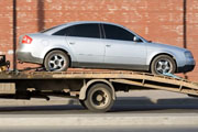 Towing truck taking car